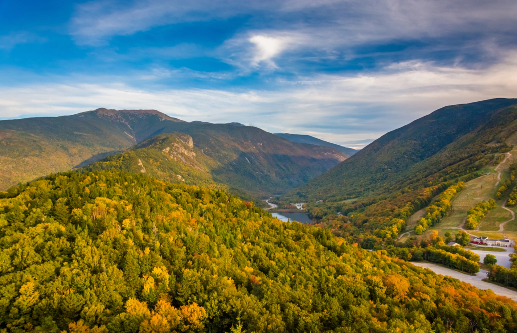 An image depicting the trail Hi - Cannon and Lonesome Lakes Loop Trail and its surrounding area.