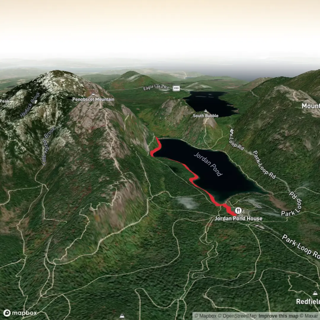 An image depicting the trail Deer Brook Falls via Jordan Pond Path and its surrounding area.