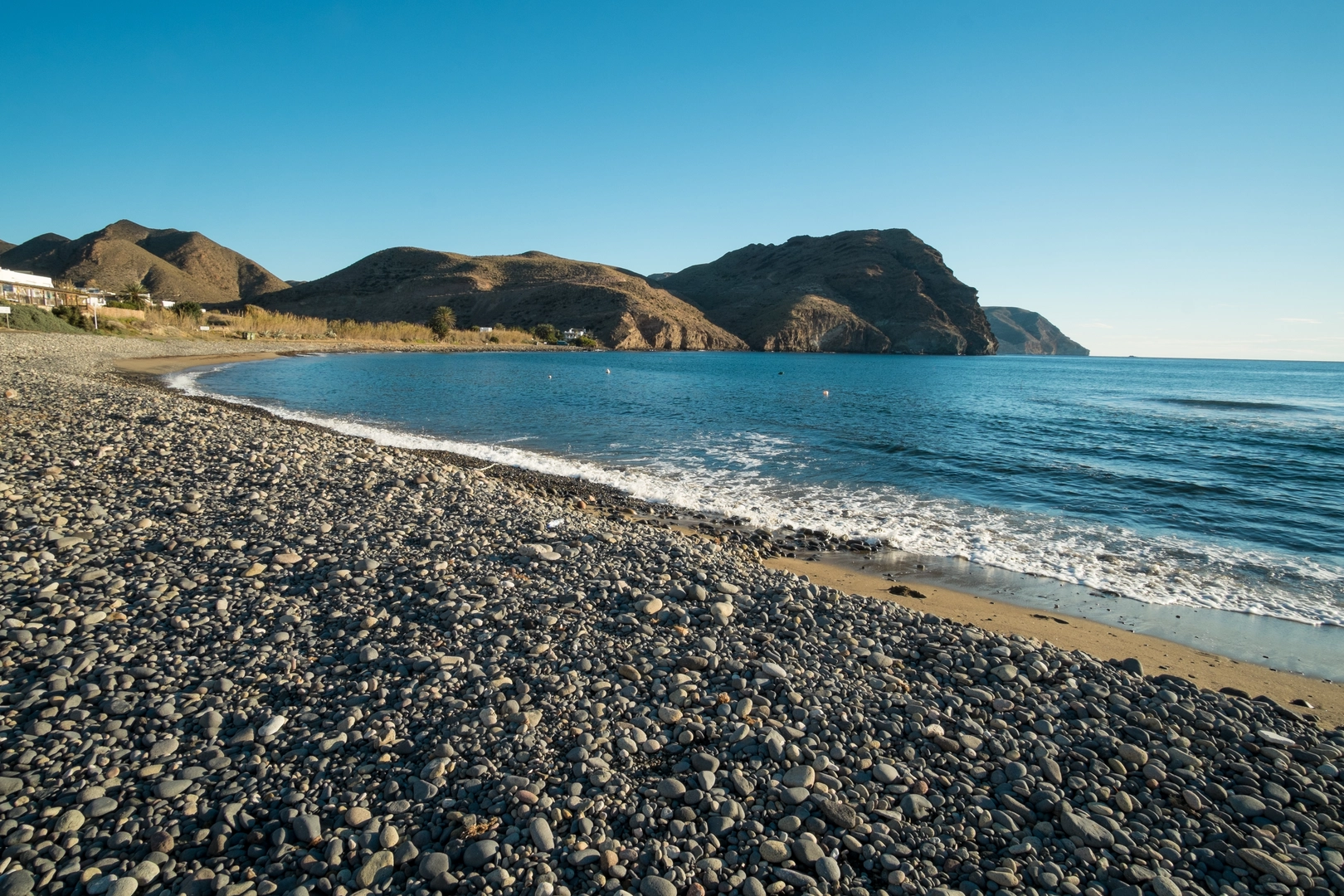 An image depicting the trail Las Negras - Cala Del Bergaintin and its surrounding area.