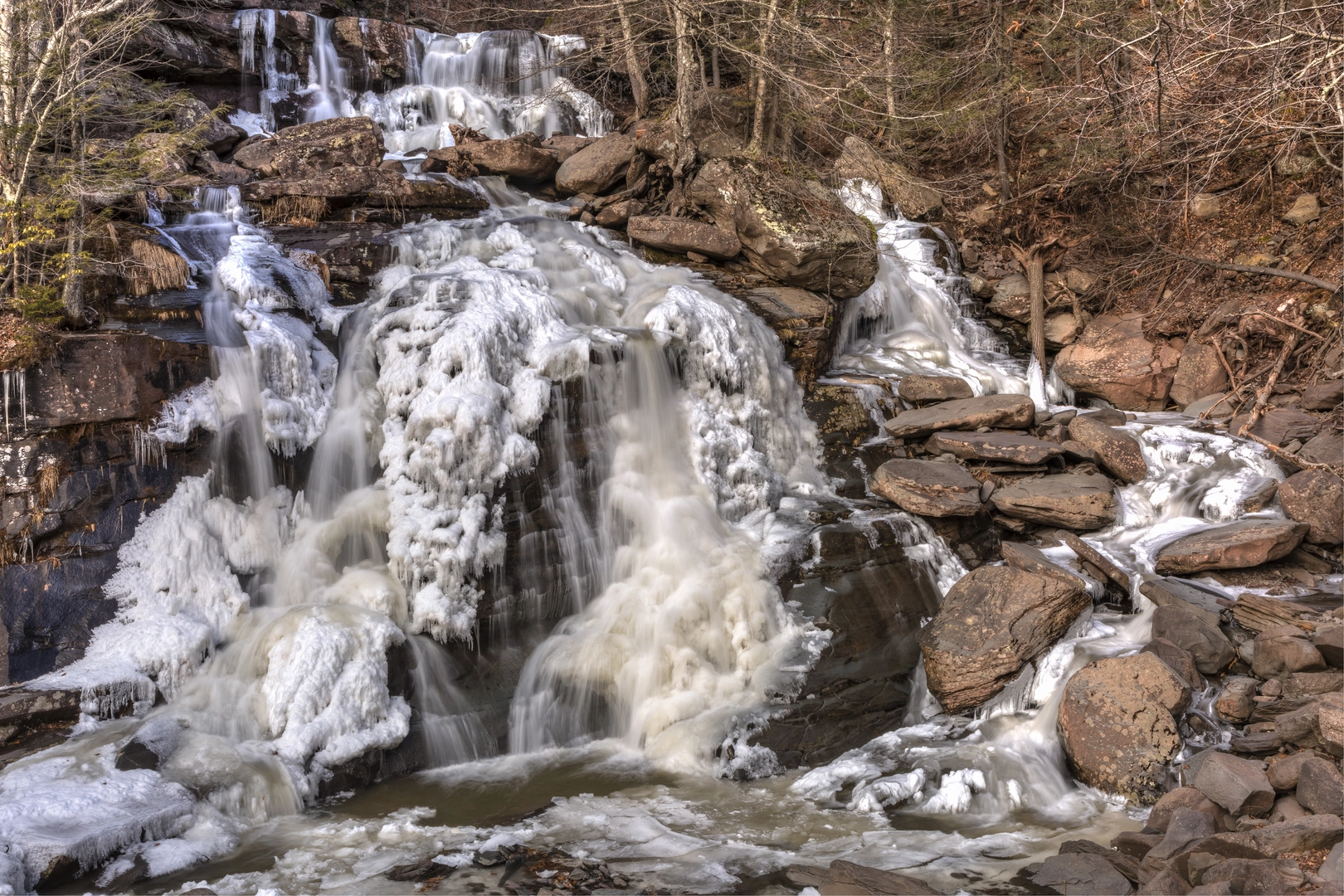 An image depicting the trail Bastion Falls and Kaaterskill Falls Trail and its surrounding area.