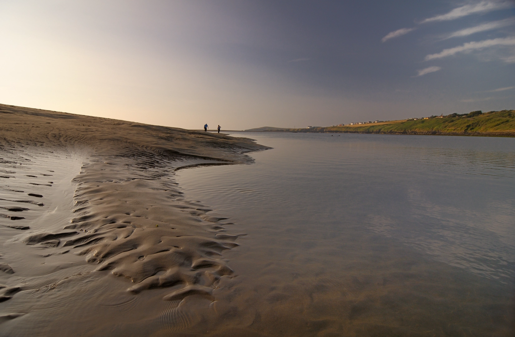 An image depicting the trail Cemaes Head and Clawddcam from Poppit Sands and its surrounding area.