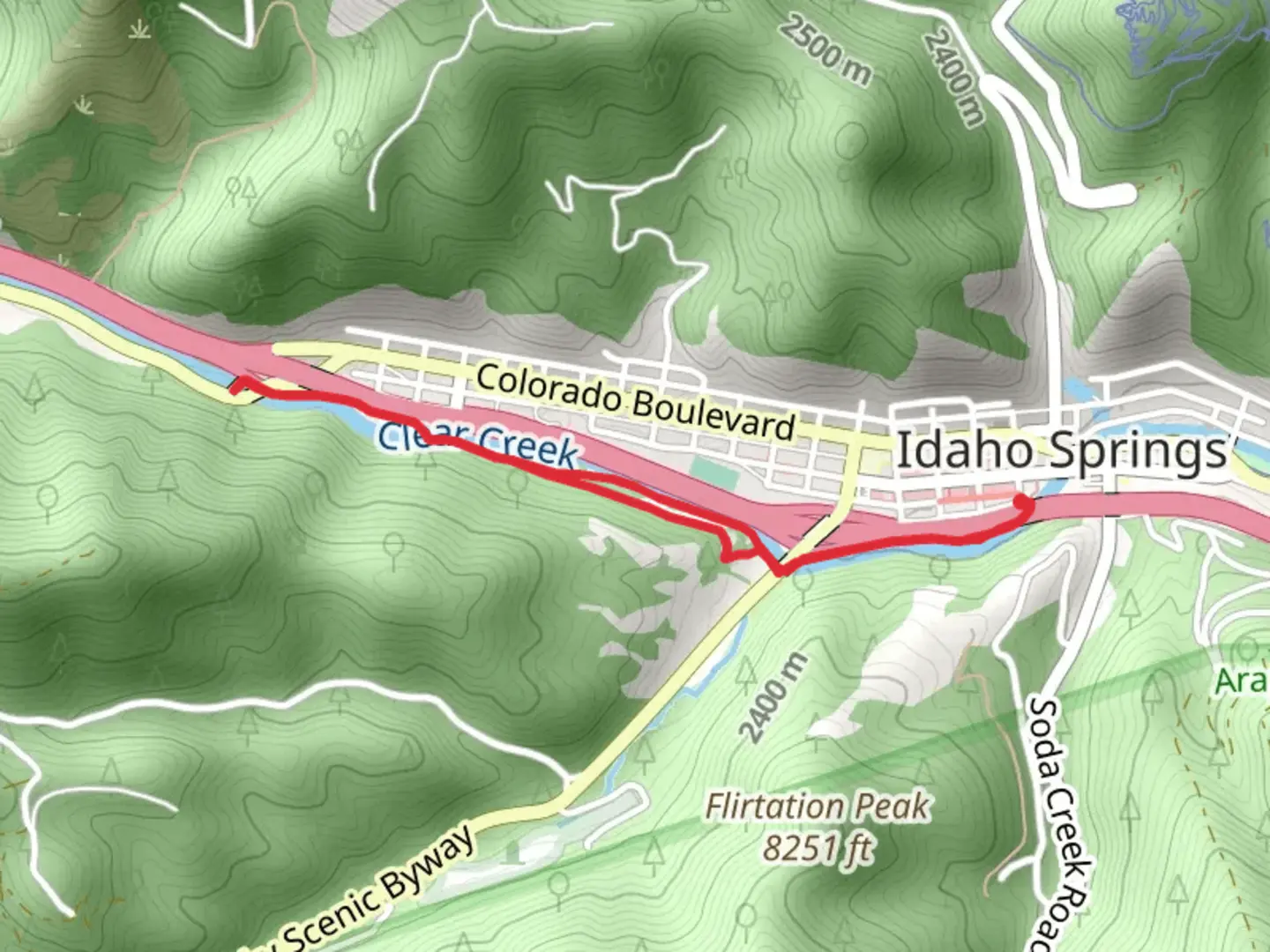 An image depicting the trail Clear Creek Greenway and its surrounding area.