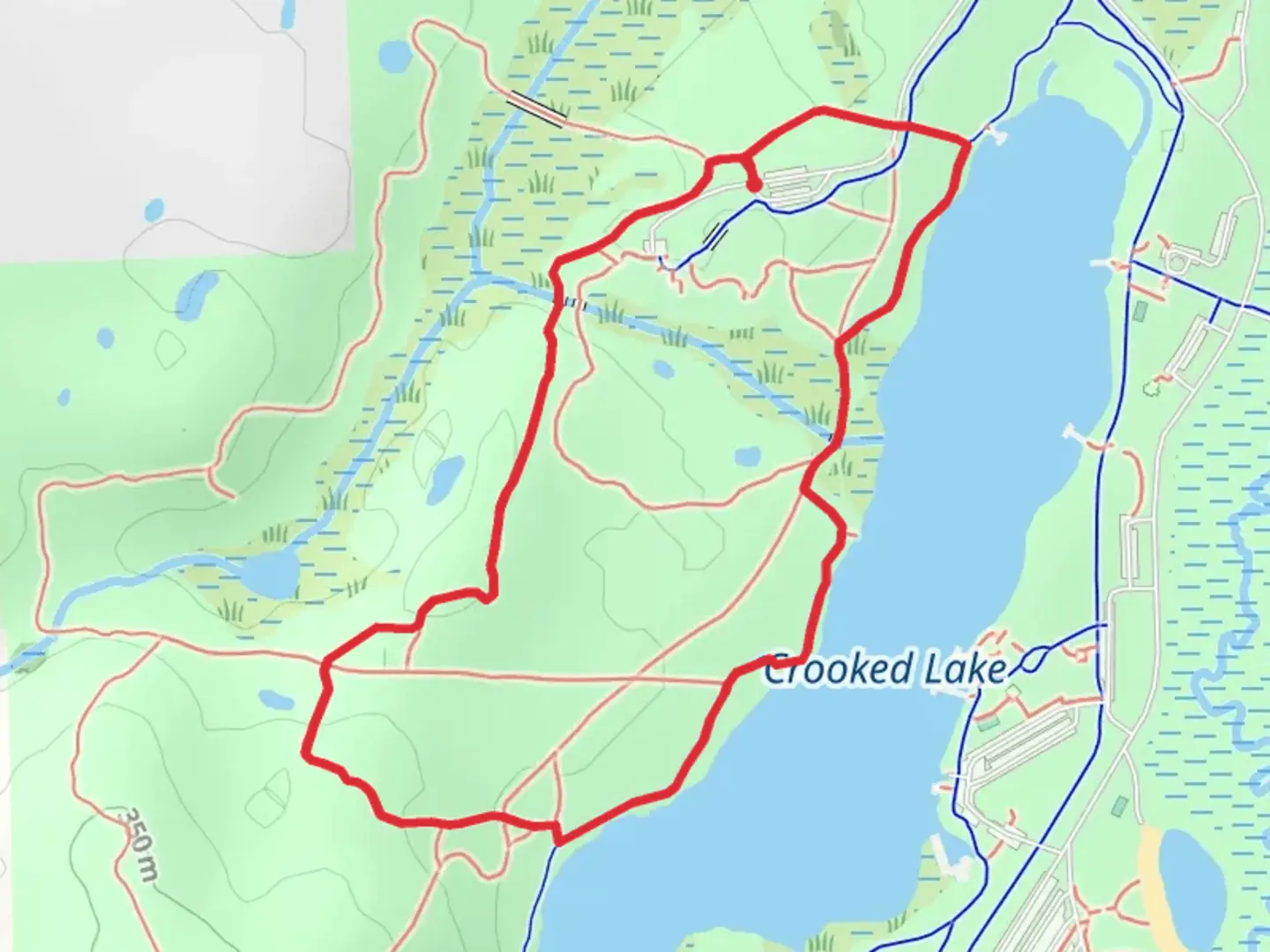 An image depicting the trail Crooked Lake - Rockridge Loop Trail and its surrounding area.
