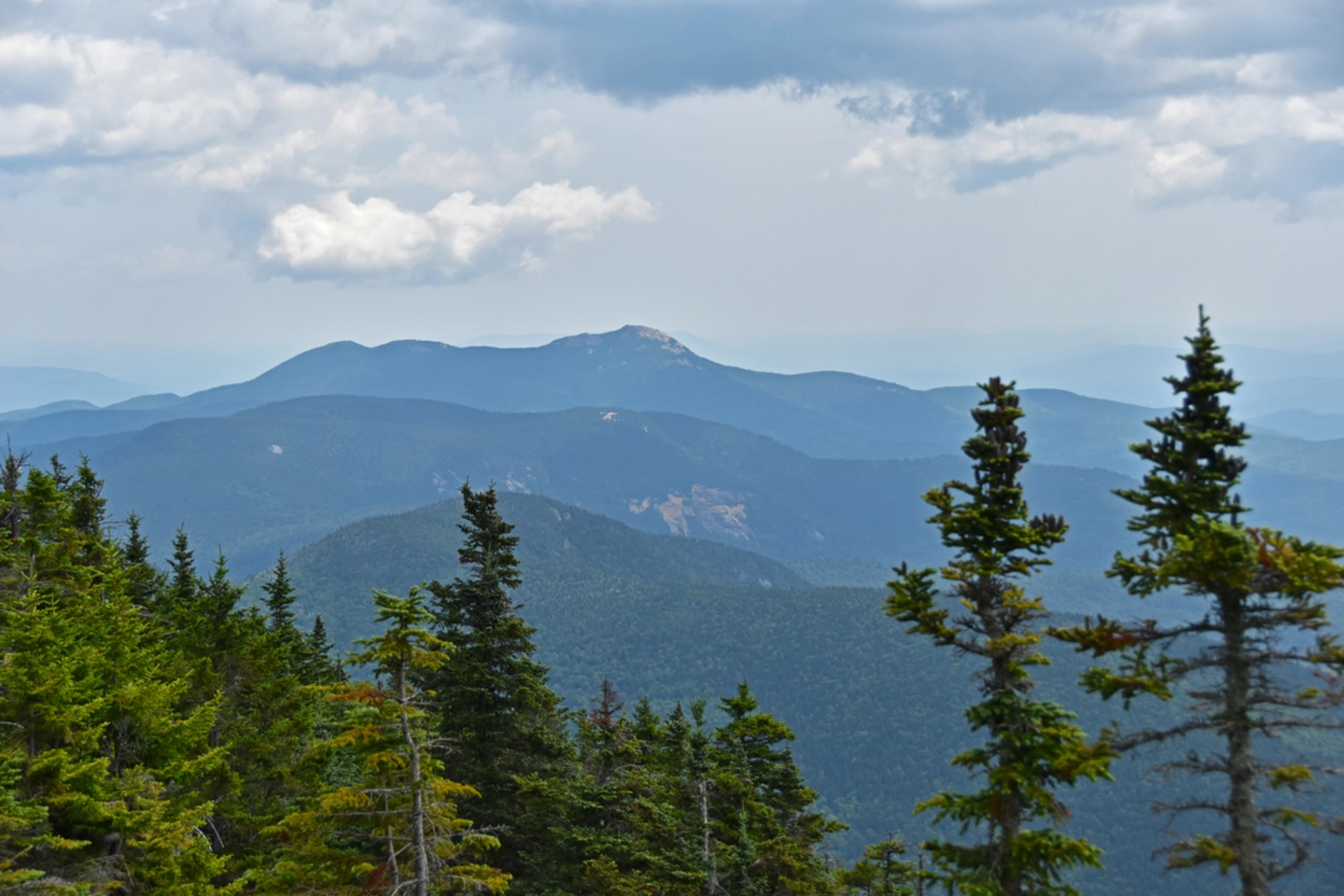 An image depicting the trail Sandwich Mountain via Bennett Street Trail and its surrounding area.