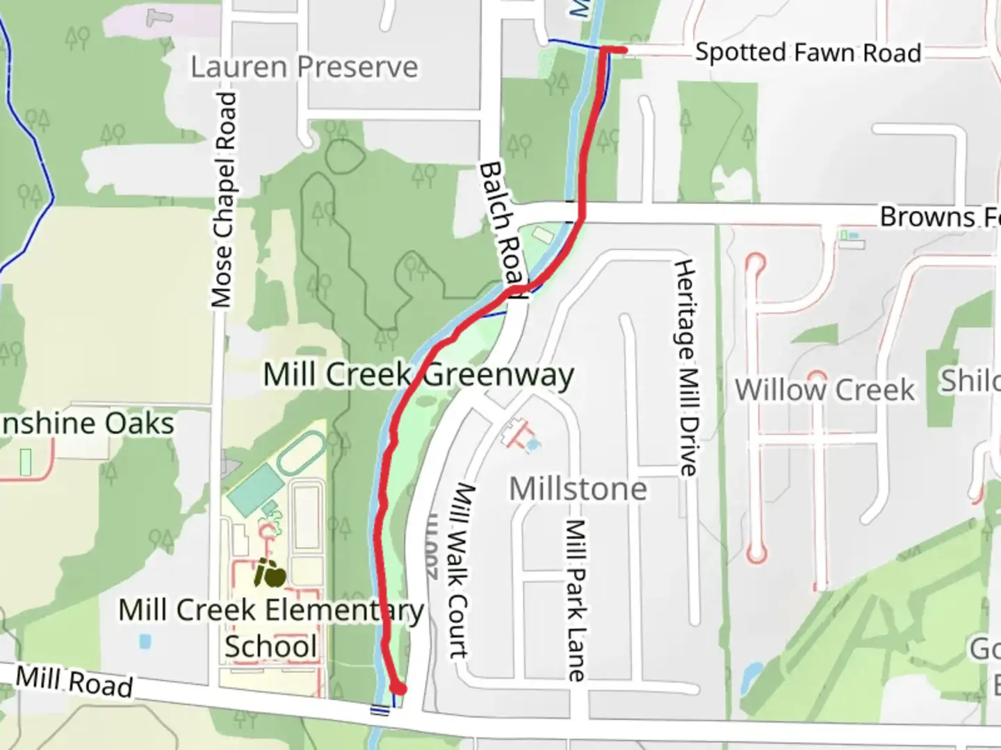 An image depicting the trail Mill Creek Greenway and its surrounding area.