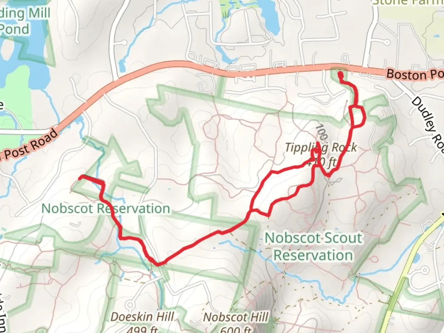 An image depicting the trail Tippling Rock via Bay Circuit Trail and its surrounding area.