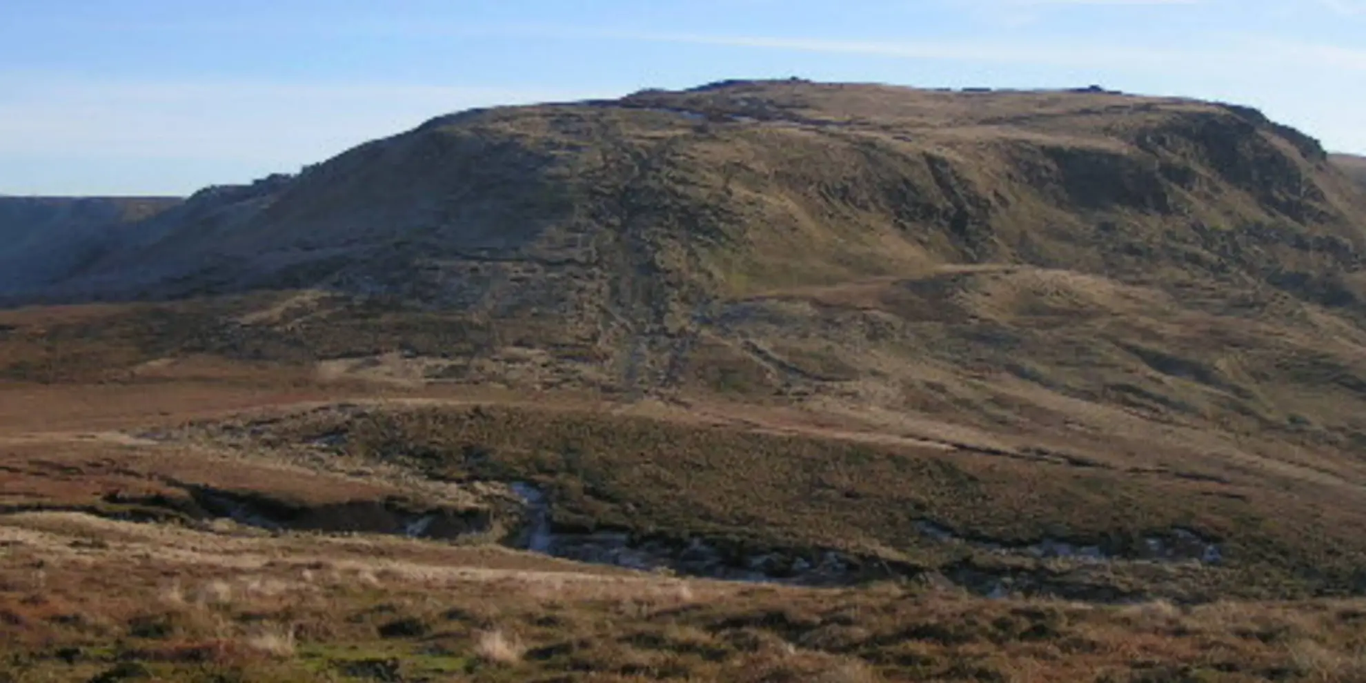 An image depicting the trail The Summit of Kinder Scout via The Cloughs and its surrounding area.