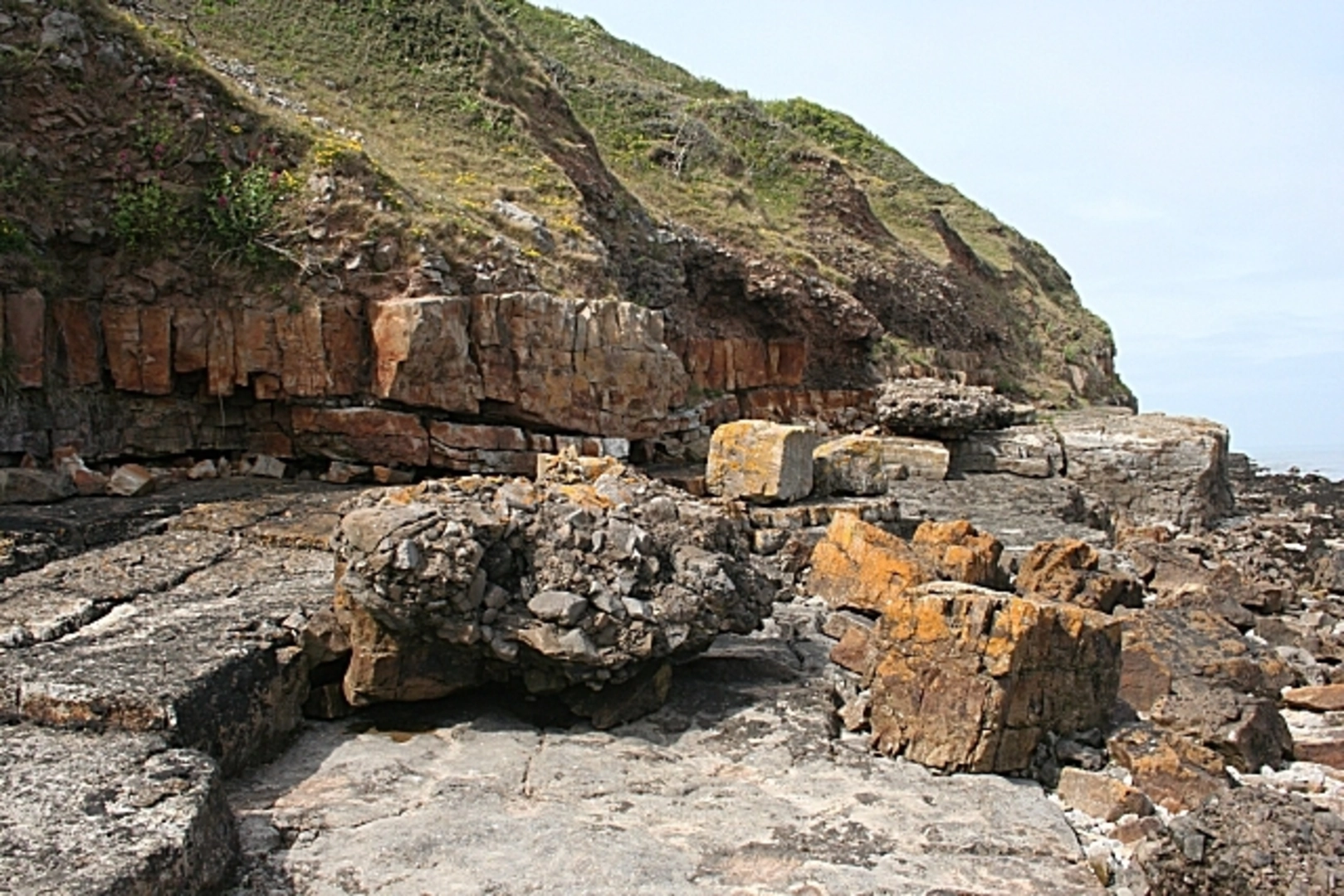An image depicting the trail Benllech to Red Wharf Bay Walk and its surrounding area.