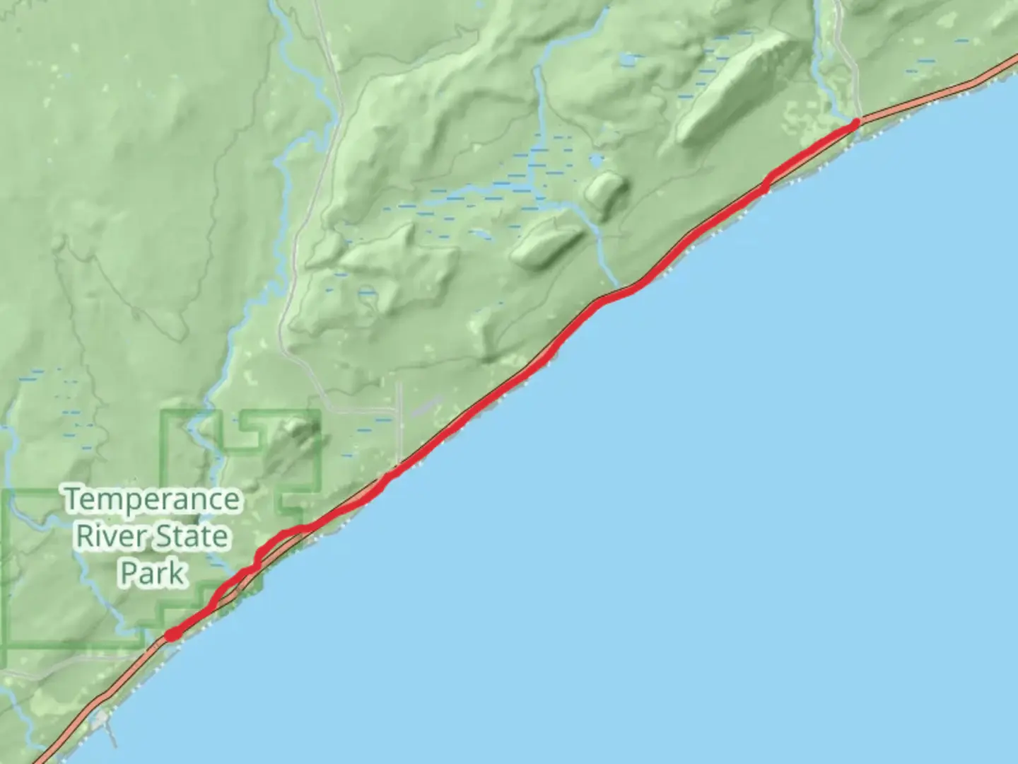 An image depicting the trail Gitchi-Gami State Trail and its surrounding area.