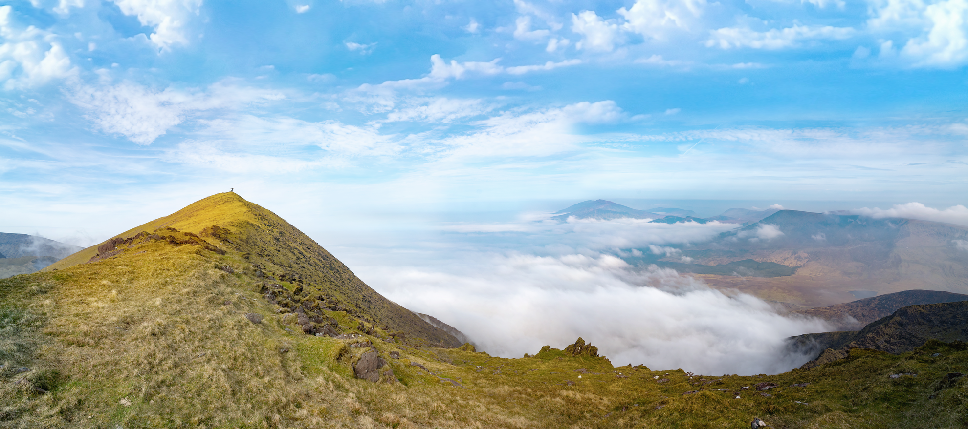 An image depicting the trail Mount Brandon from Faha and its surrounding area.