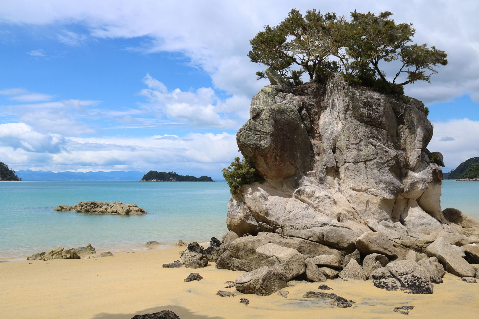 An image depicting the trail Observation Beach via Abel Tasman Coastal Track and its surrounding area.