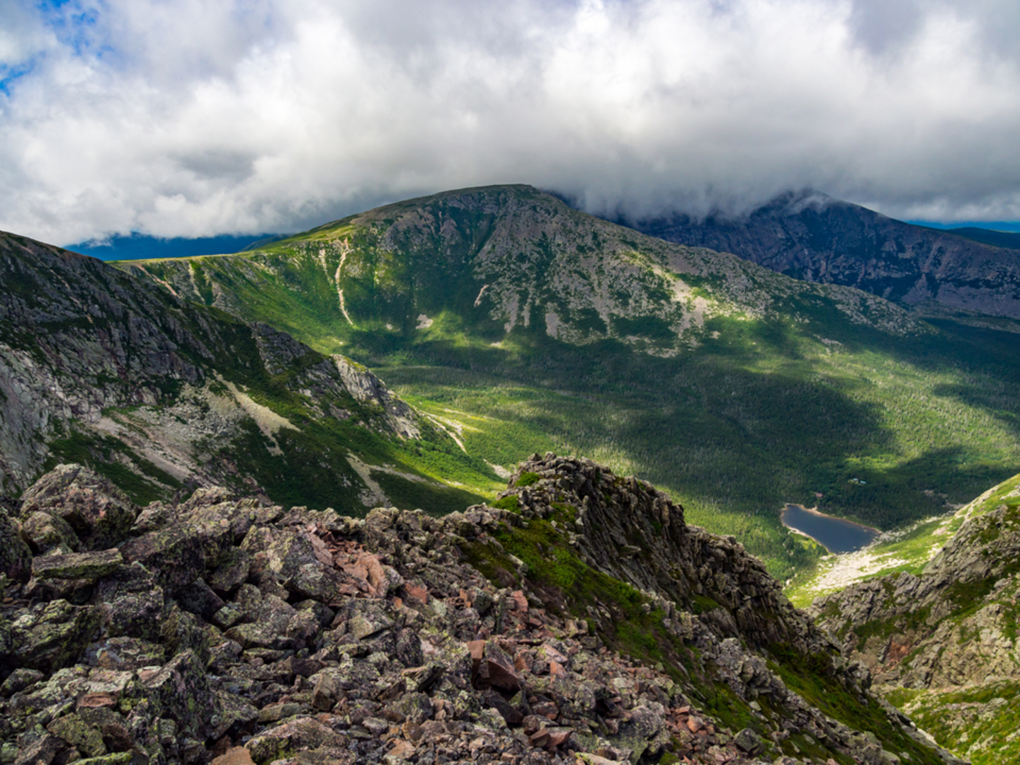 An image depicting the trail Pamola Peak, Chimney Pond and North Basin Trail and its surrounding area.