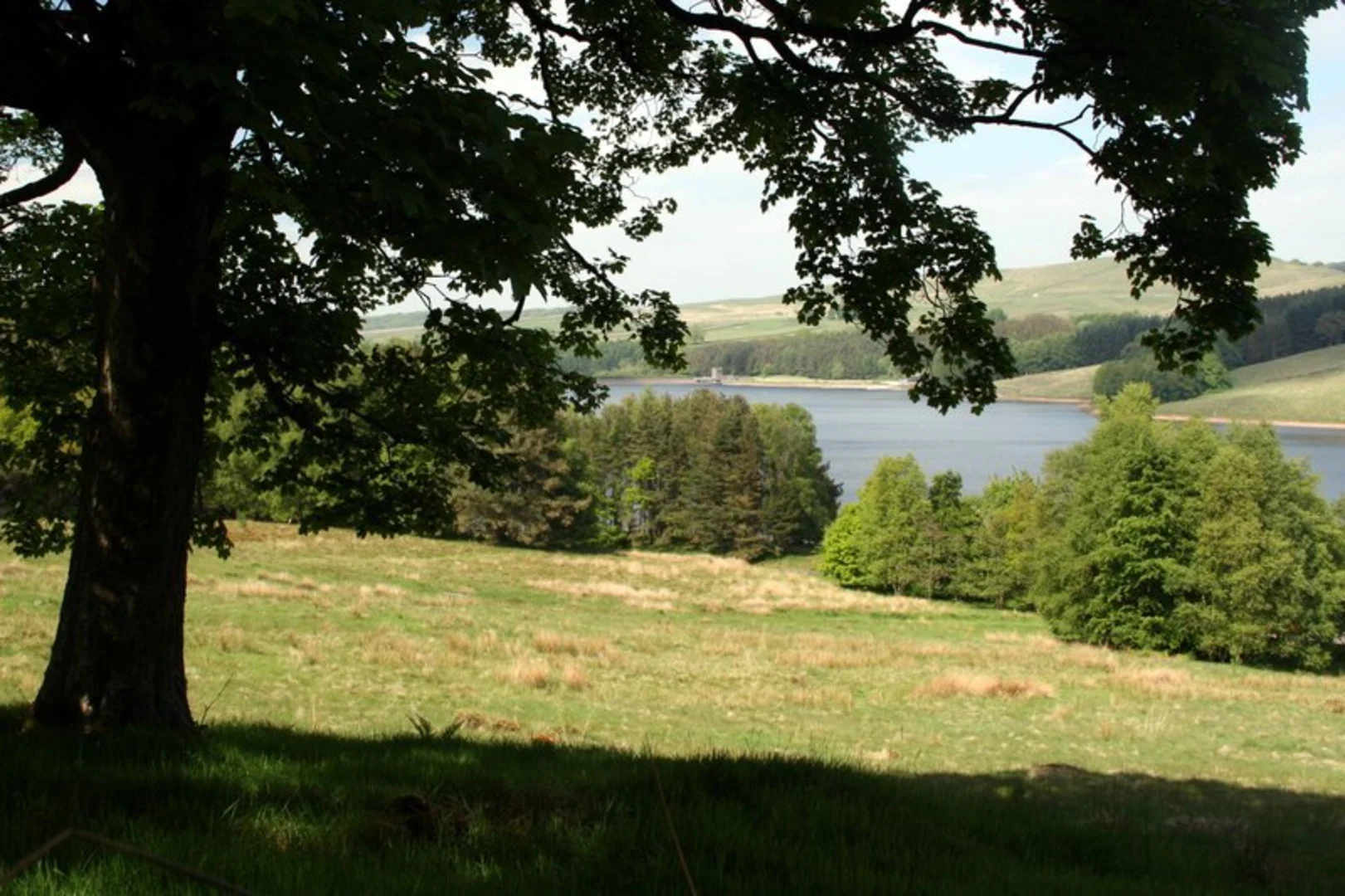 An image depicting the trail Ruin of Errwood and St Joseph's Shrine from Errwood Reservoir and its surrounding area.