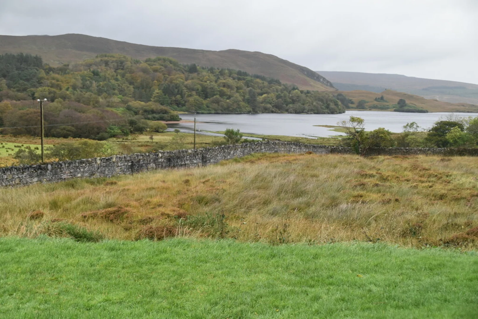 An image depicting the trail Drumnalifferney Mountain North East Top Loop from Dunlewey Lough and its surrounding area.