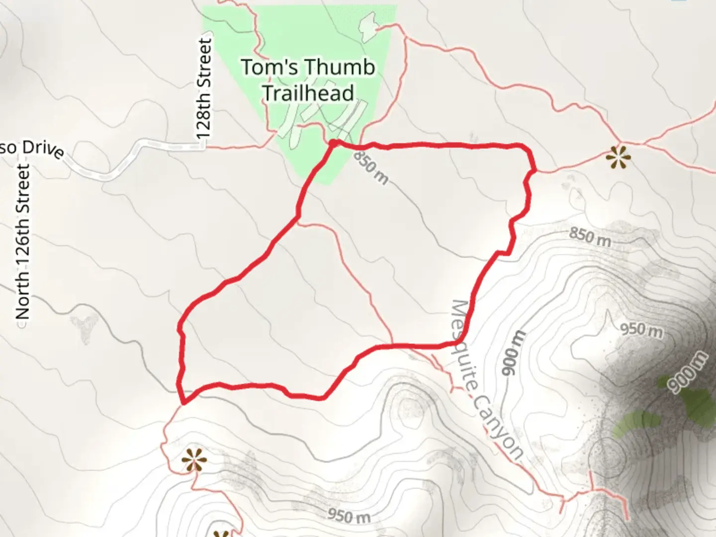 An image depicting the trail Tom's Thumb - Mesquite Canyon Loop Trail and its surrounding area.