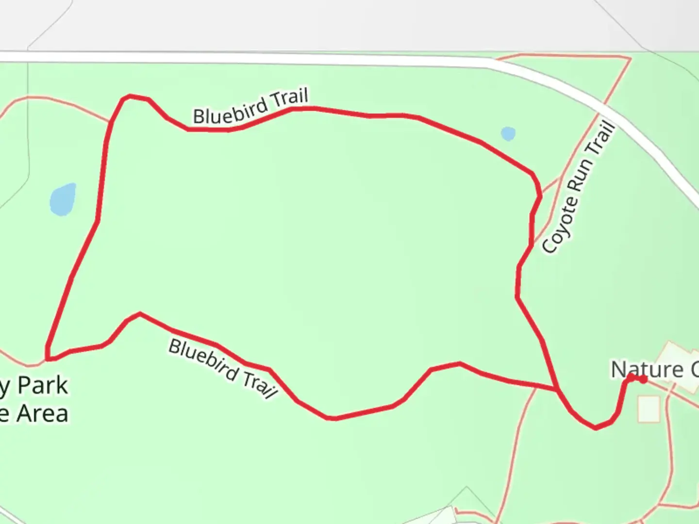 An image depicting the trail Coyote Run and Bluebird Loop Trail and its surrounding area.
