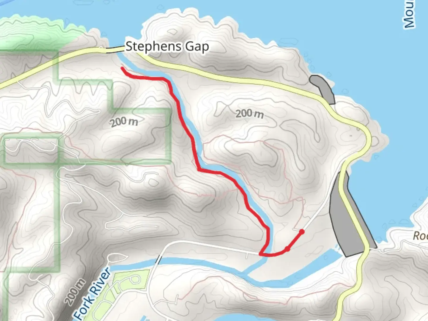 An image depicting the trail Walk along Mountain Fork River and its surrounding area.