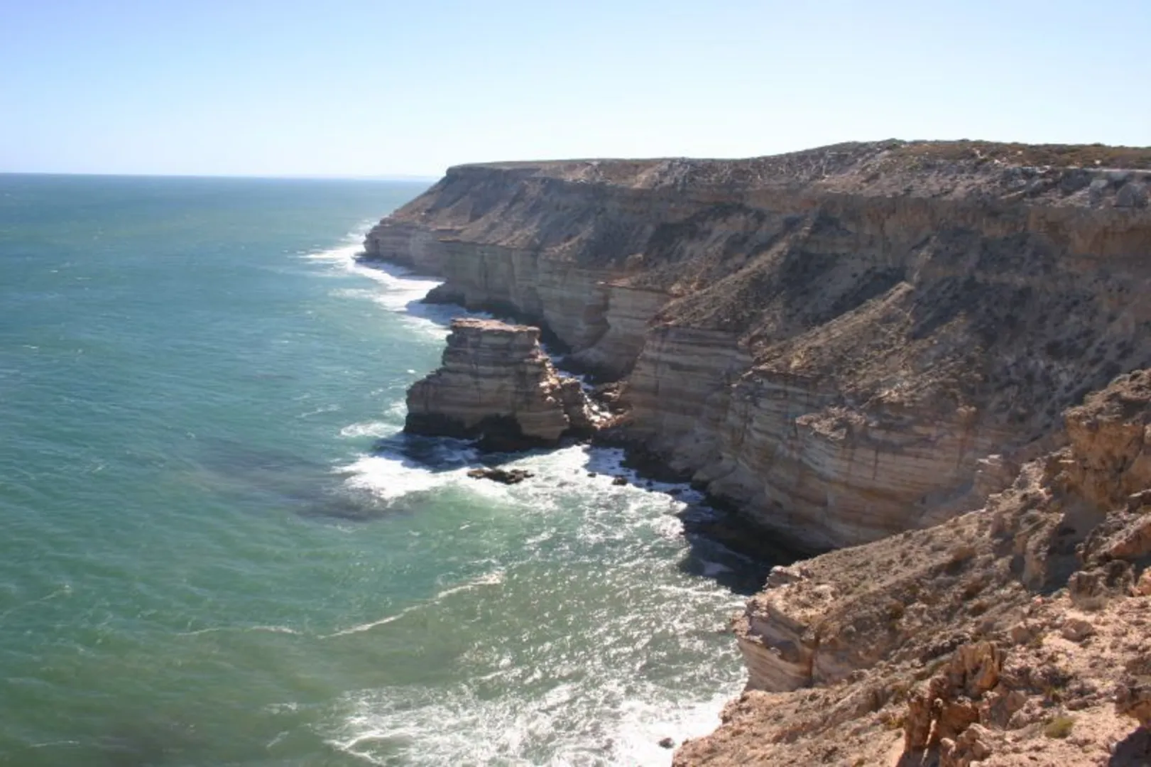An image depicting the trail Island Rock to Natural Bridge Walk and its surrounding area.