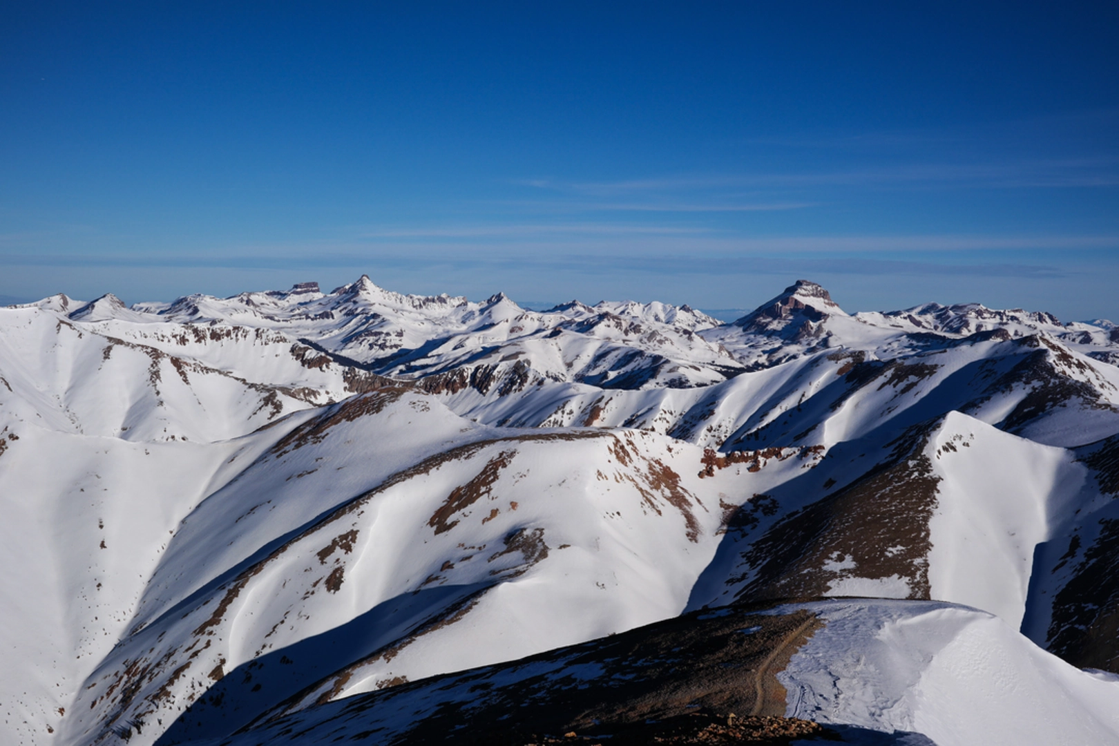 An image depicting the trail Sunshine Peak Trail and its surrounding area.