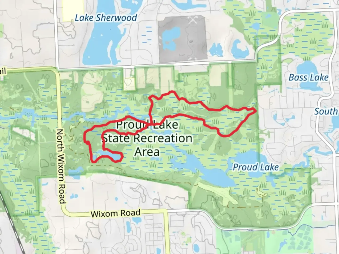 An image depicting the trail Proud Lake Recreation Area - Chief Pontiac Hiking Trail and its surrounding area.