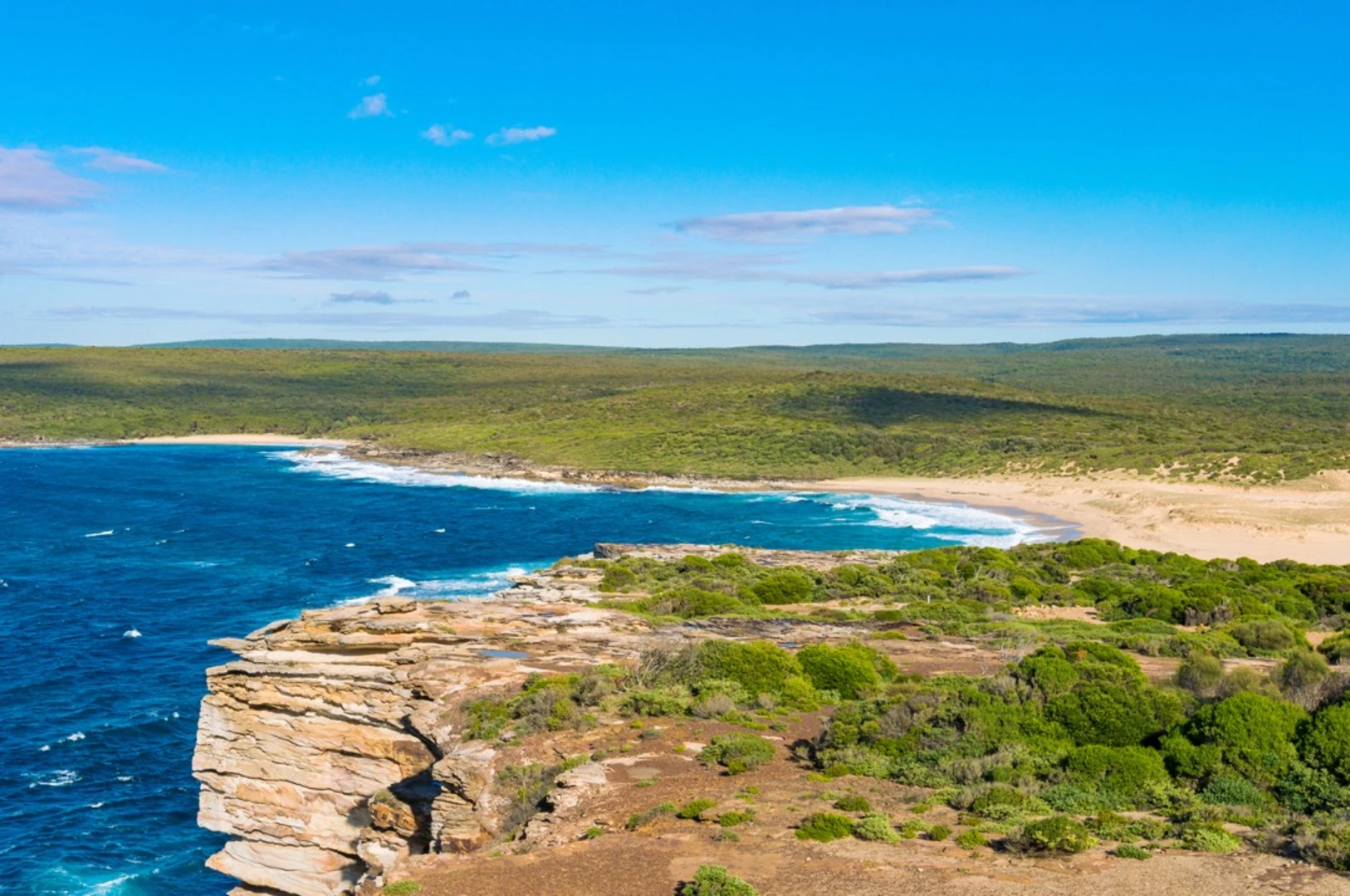 An image depicting the trail The Coast Track and its surrounding area.