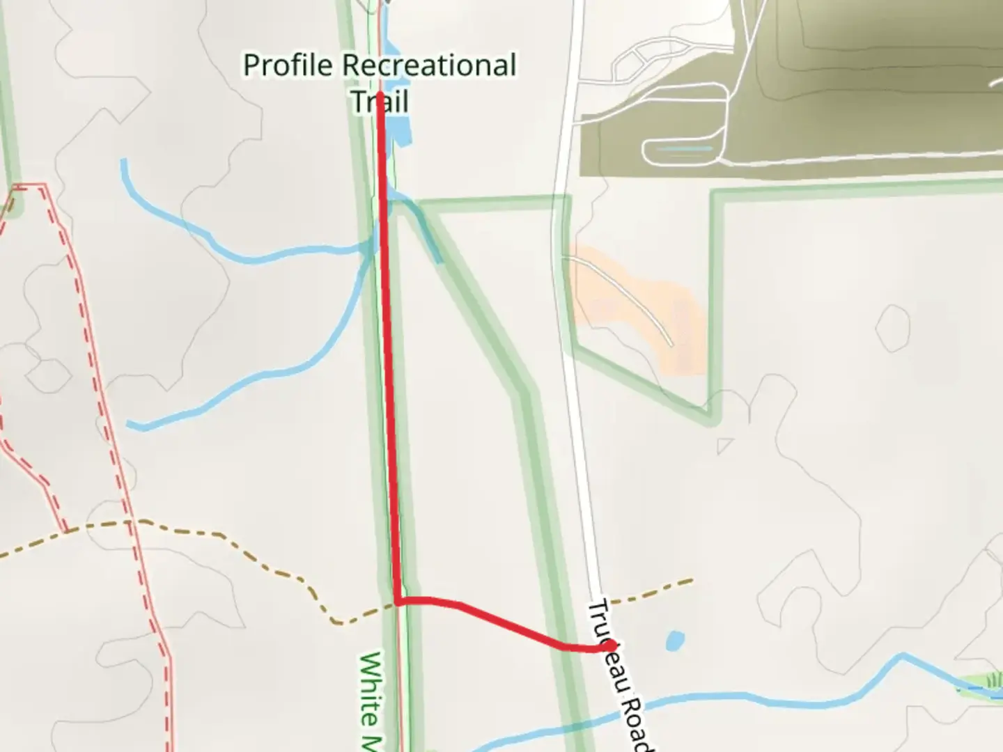 An image depicting the trail Profile Recreational Trail from Trudeau Road and its surrounding area.