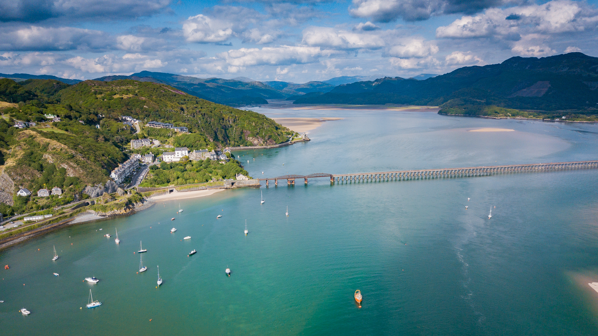 An image depicting the trail Mawddach Bridge and Arthog from Barmouth and its surrounding area.