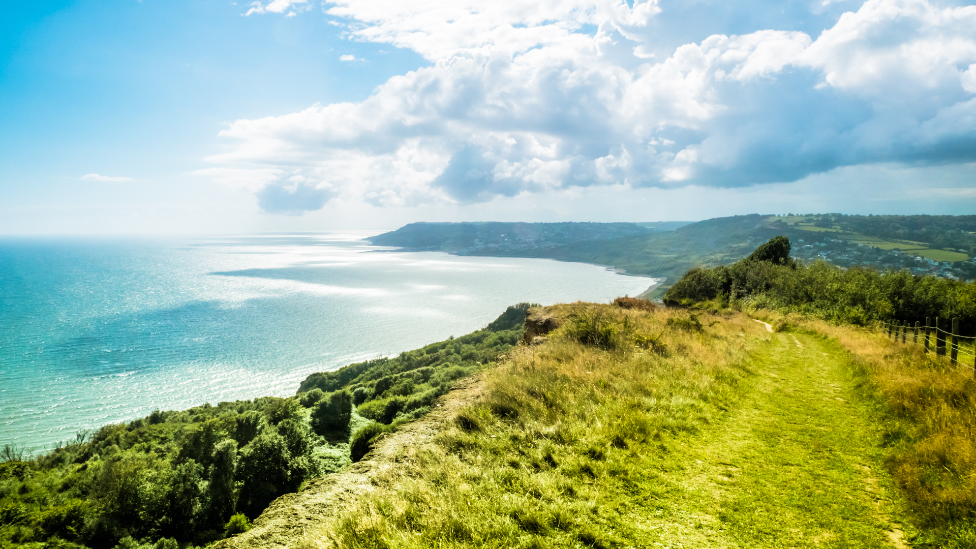 An image depicting the trail SWCP and Stonebarrow Hill from West Bay and its surrounding area.