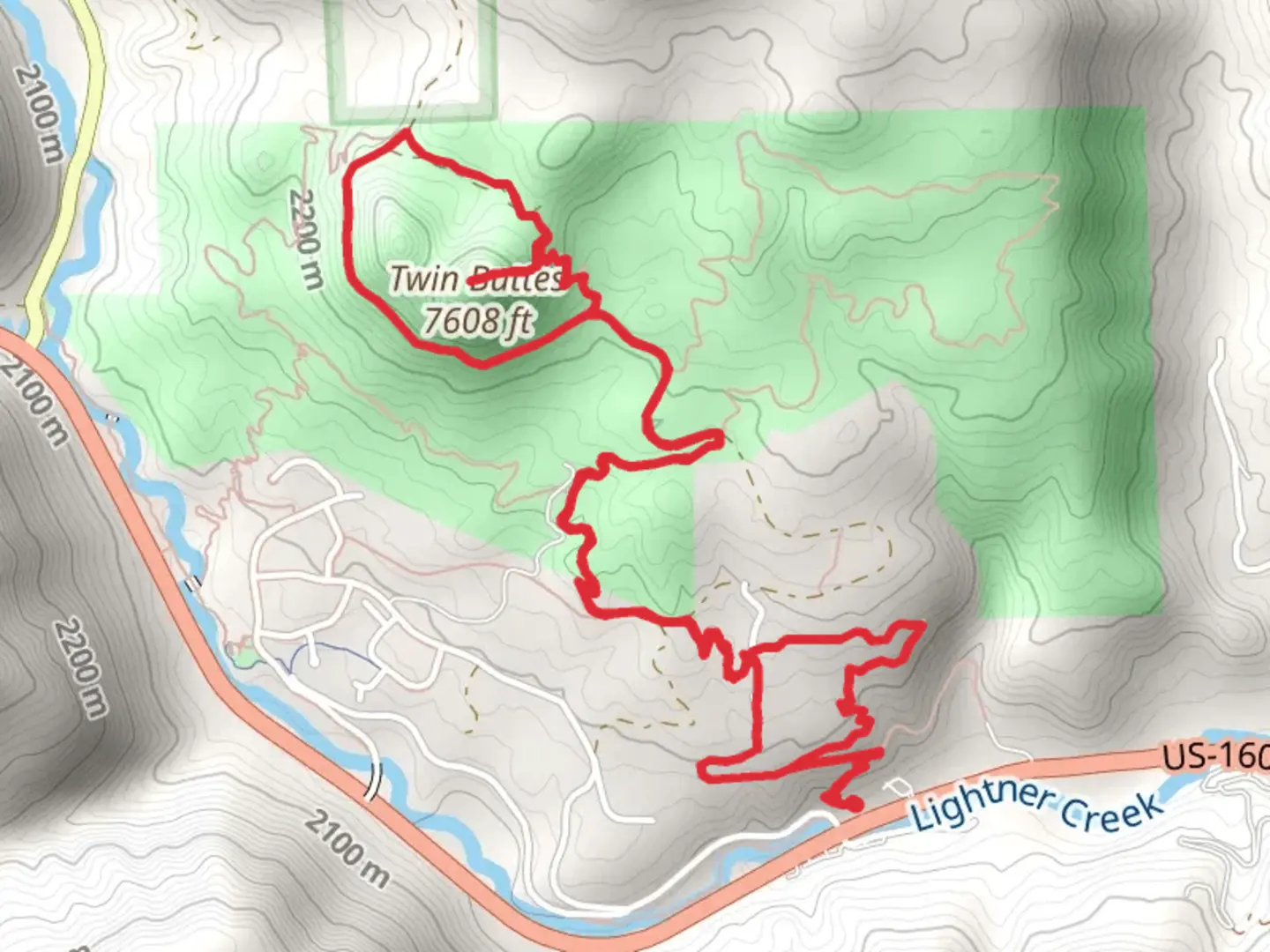 An image depicting the trail Twin Buttes and Upper Twin Buttes Loop Trail and its surrounding area.