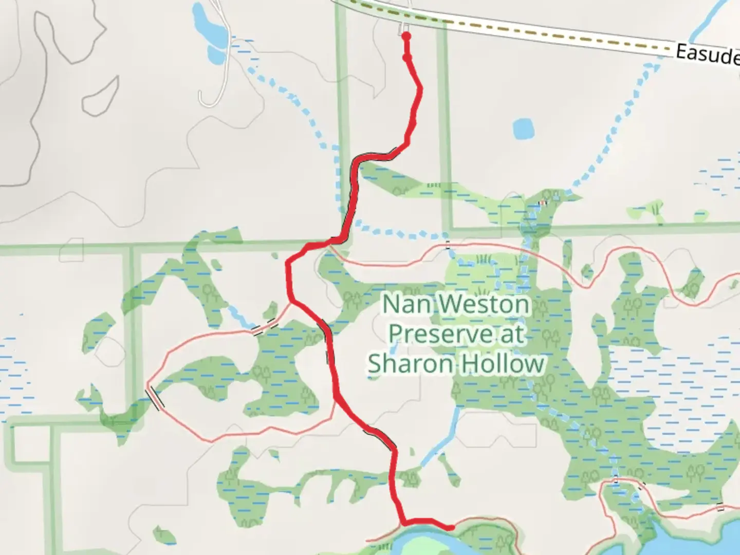 An image depicting the trail River Raisin in Nan Weston Preserve at Sharon Hollow and its surrounding area.