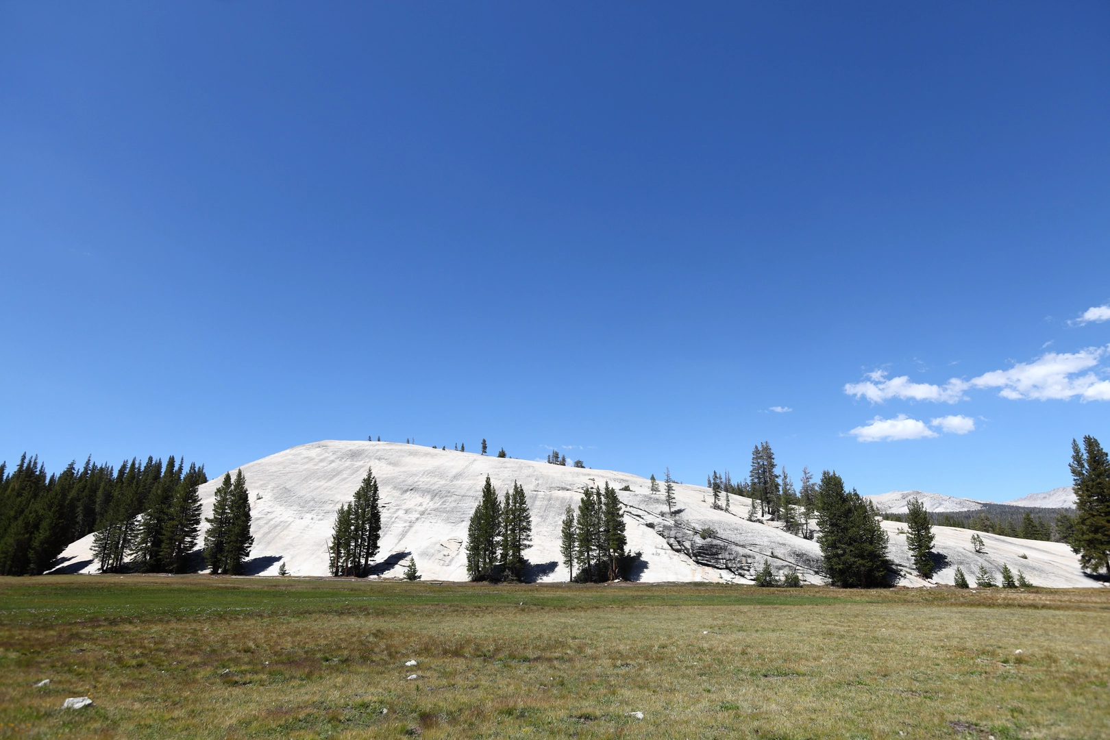 An image depicting the trail Pothole Dome and Tuolumne River and its surrounding area.