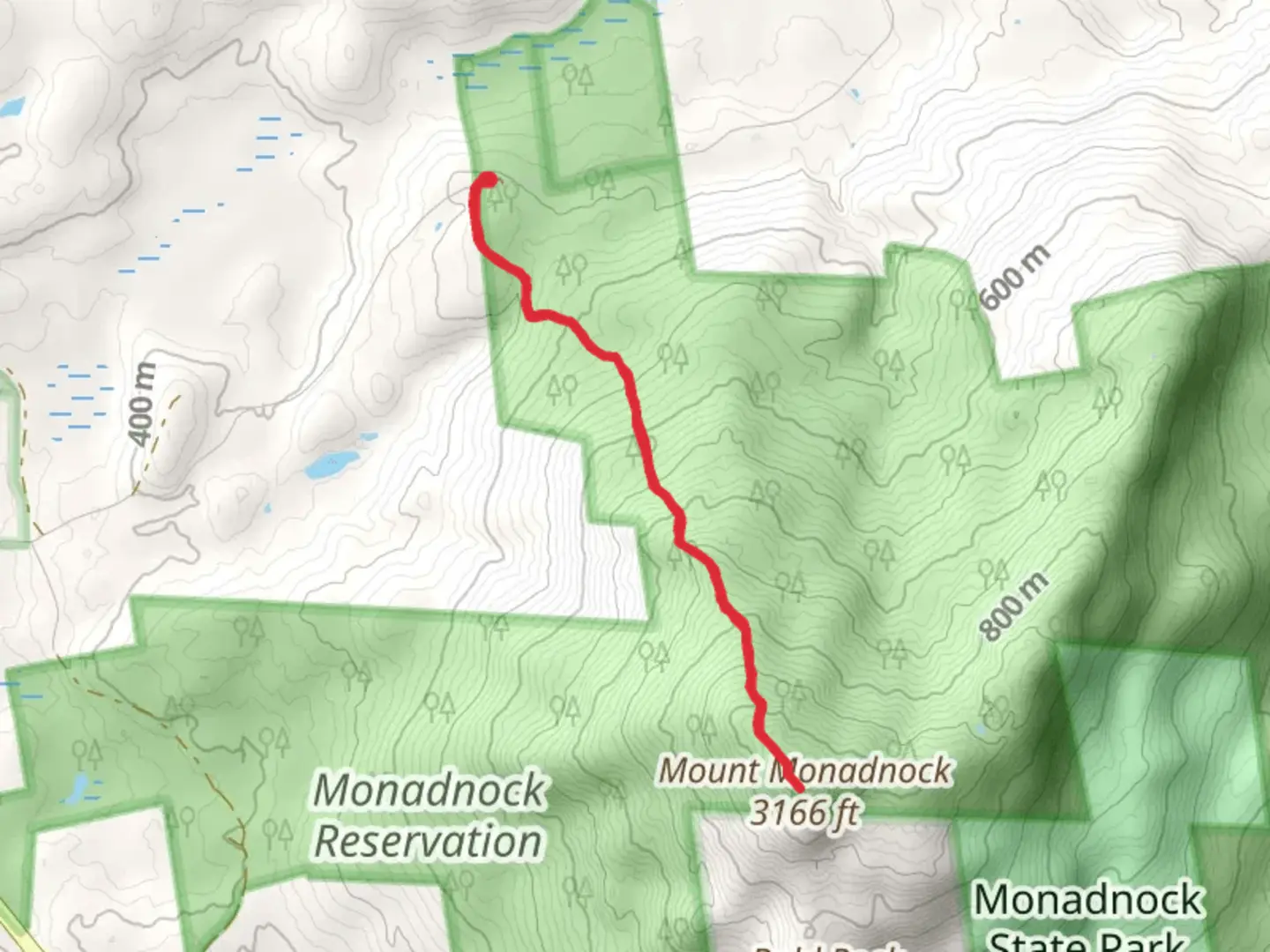An image depicting the trail Mount Monadnock via Dublin Trail and its surrounding area.