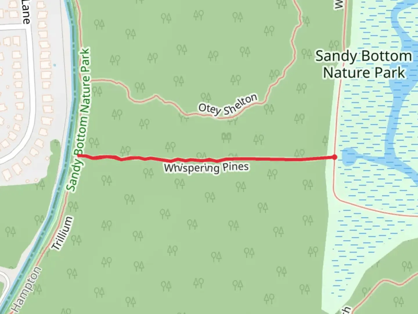 An image depicting the trail Whispering Pines and its surrounding area.