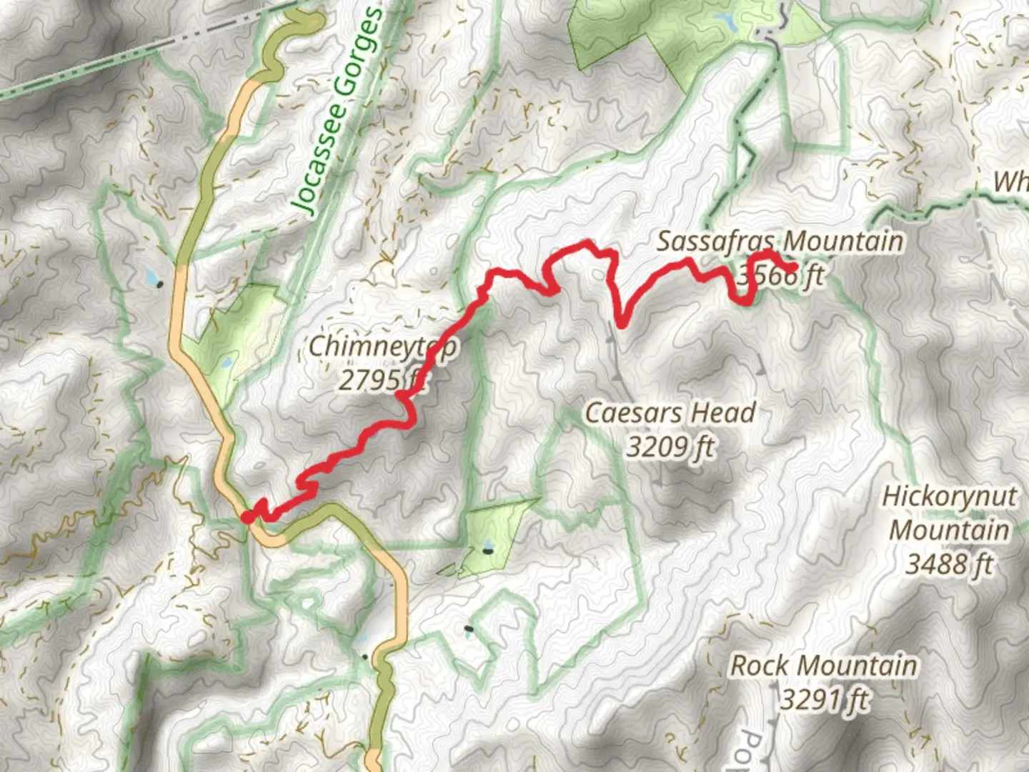 An image depicting the trail Sassafras Mountain via Foothills Trail and its surrounding area.