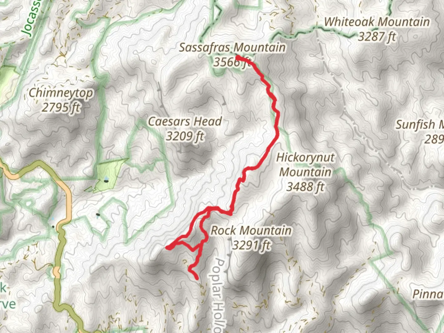 An image depicting the trail Roundtop Mountain via Foothills Trail and its surrounding area.