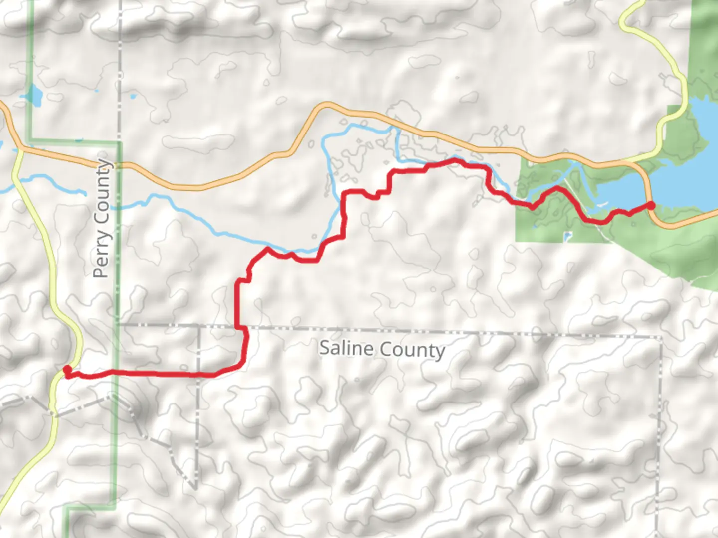 An image depicting the trail Ouachita Trail from State Highway 9 and its surrounding area.