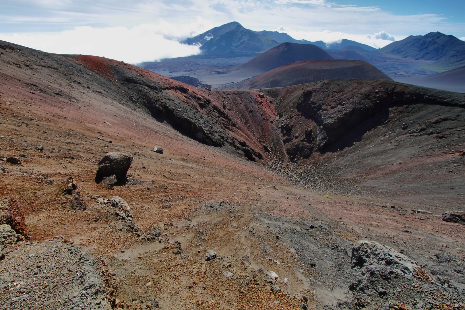 An image depicting the trail Sliding Sands Trail to Halemau'u Trailhead and its surrounding area.