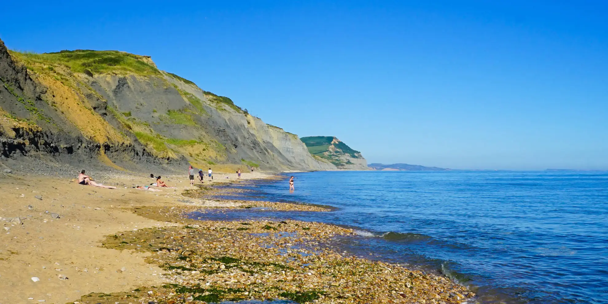 An image depicting the trail Stonebarrow Walk on the Golden Cap Estate and its surrounding area.