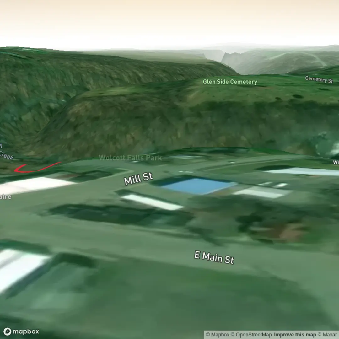 An image depicting the trail Wolcott Falls and its surrounding area.