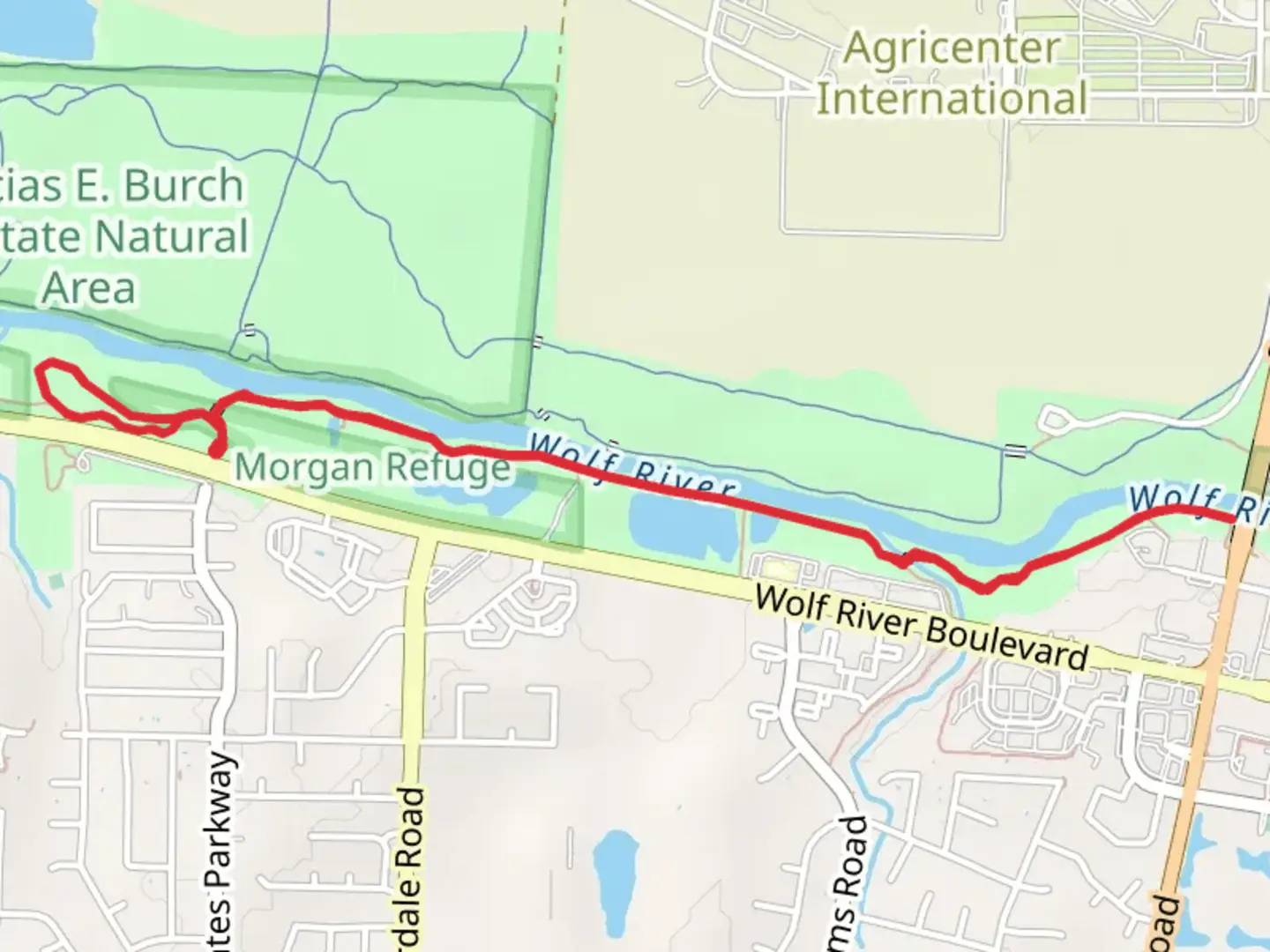 An image depicting the trail Wolf River Greenway and its surrounding area.