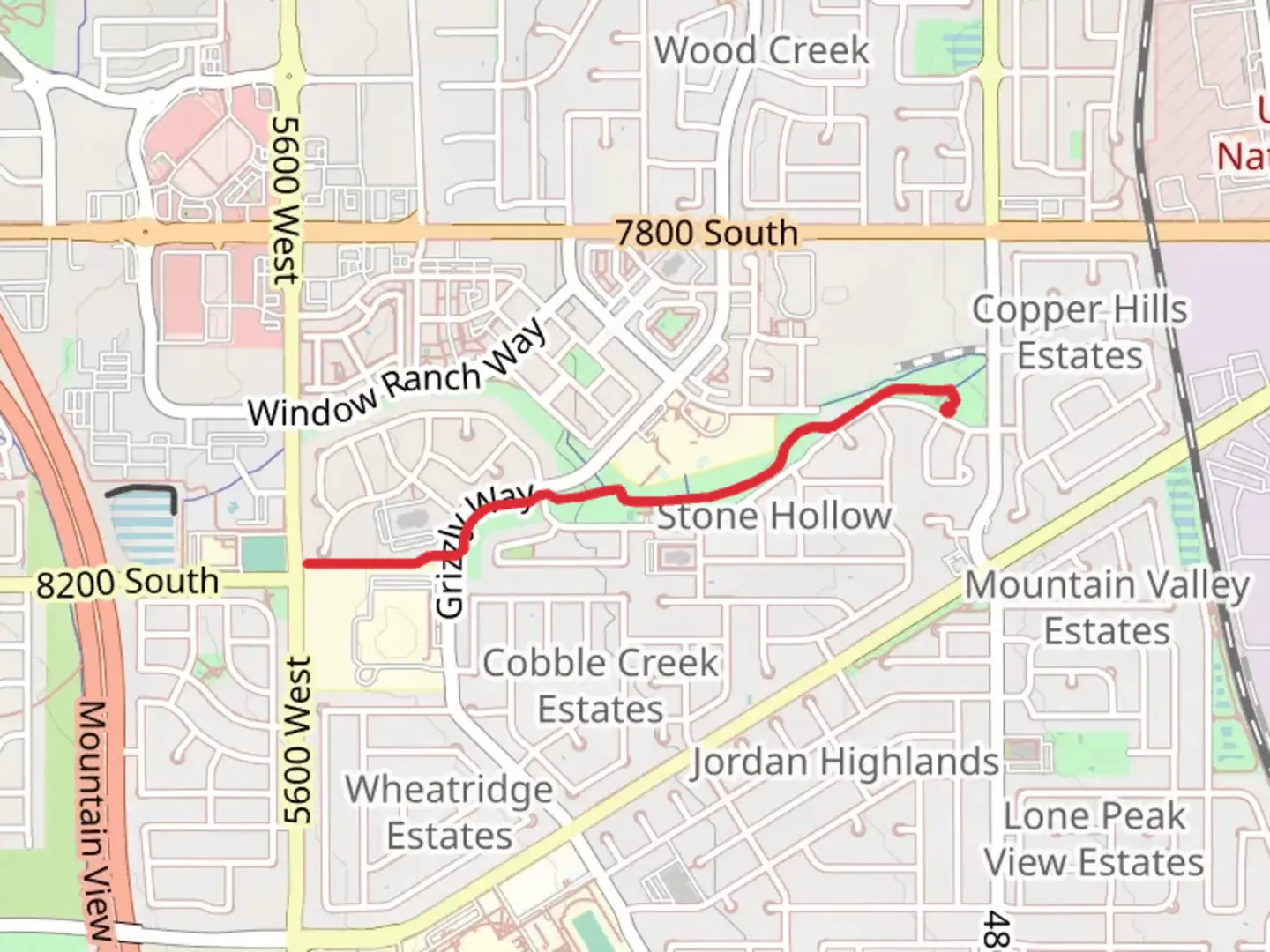 An image depicting the trail Stone Creek Park and Barney's Creek and its surrounding area.