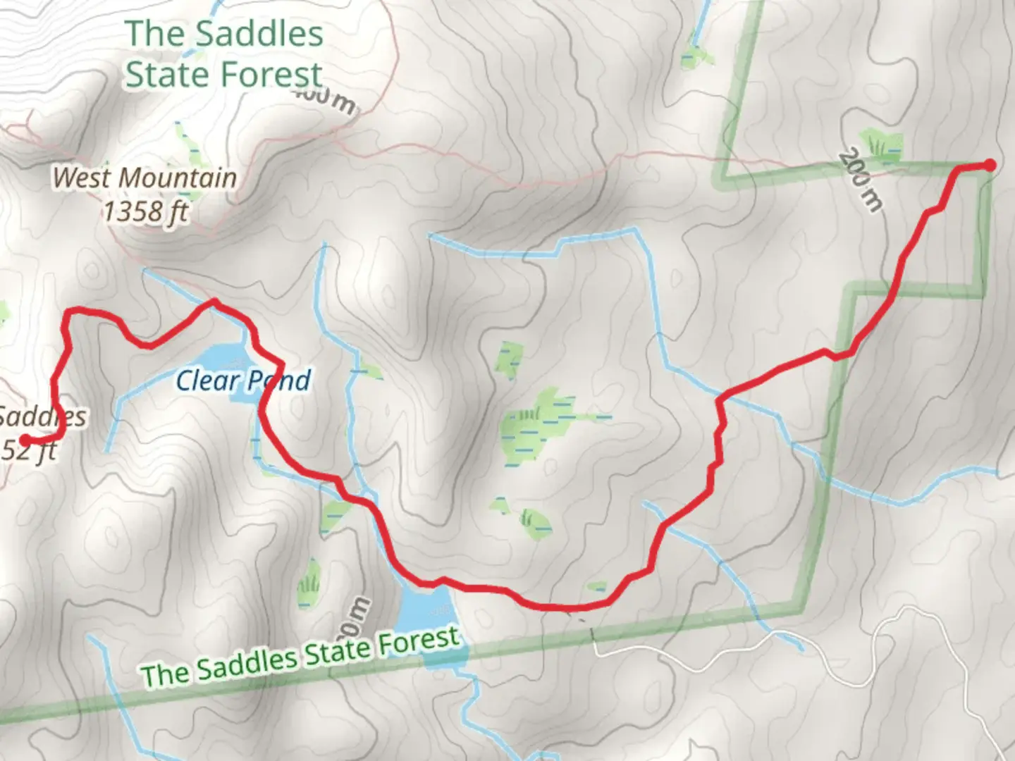 An image depicting the trail Clear Pond and The Saddles Trail and its surrounding area.