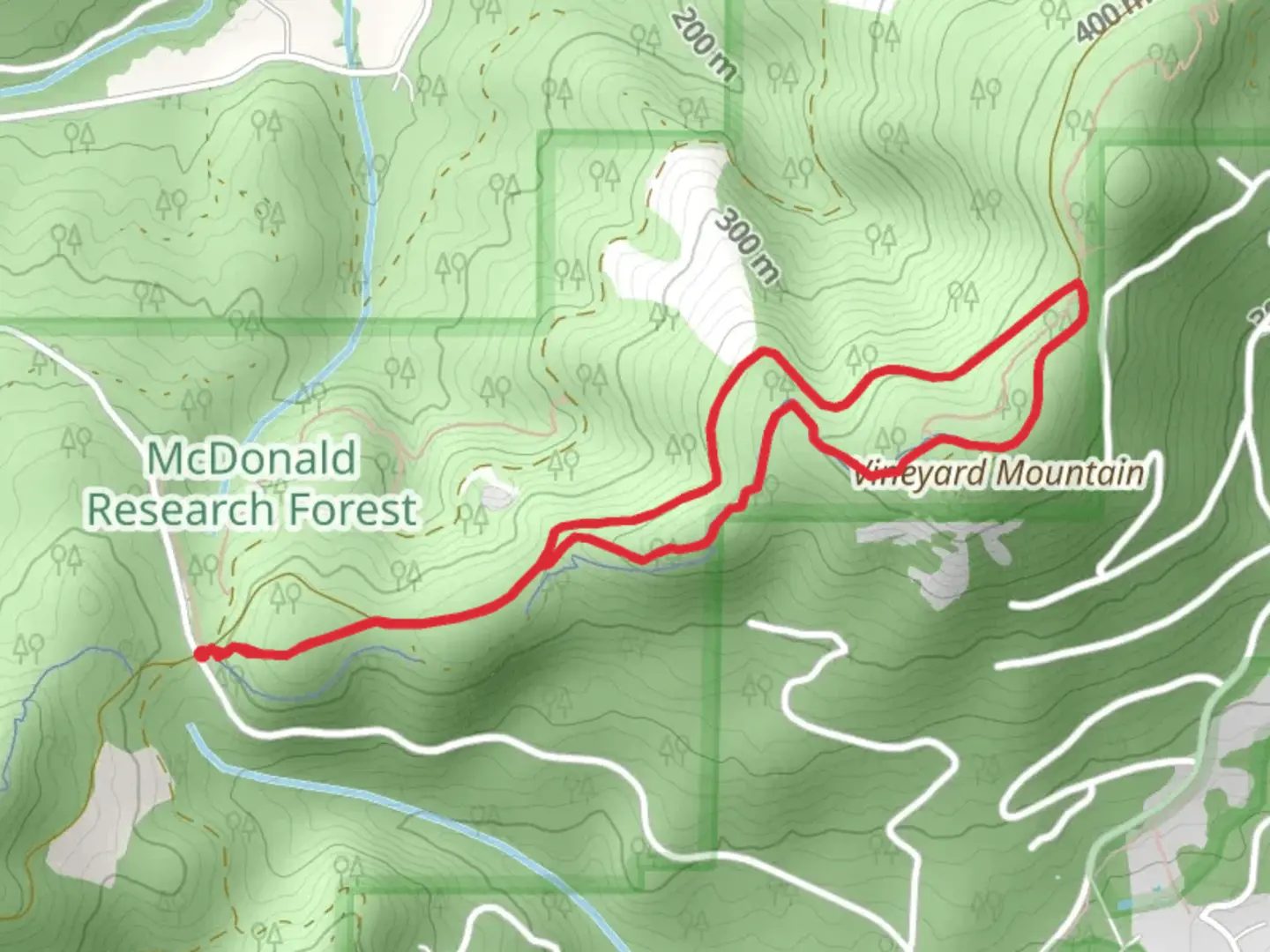 An image depicting the trail Outhouse and Vineyard Mountain Loop Trail and its surrounding area.