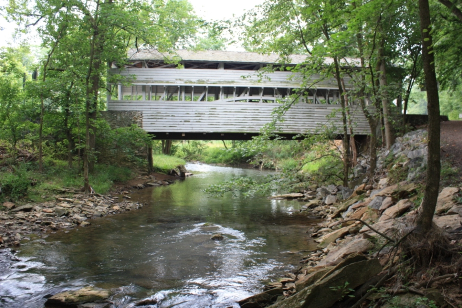 An image depicting the trail Valley Creek Trail from WIlson Road and its surrounding area.