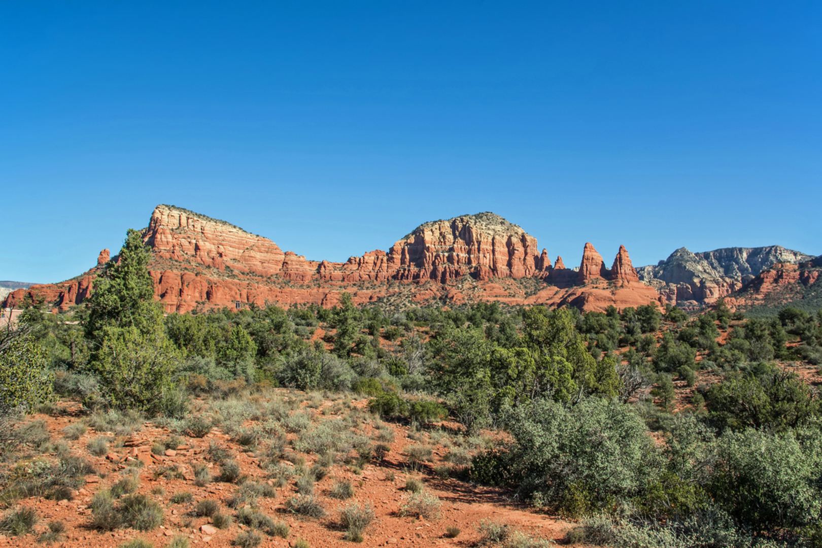 An image depicting the trail Hog Wash Trail via Broken Arrow Trail and its surrounding area.