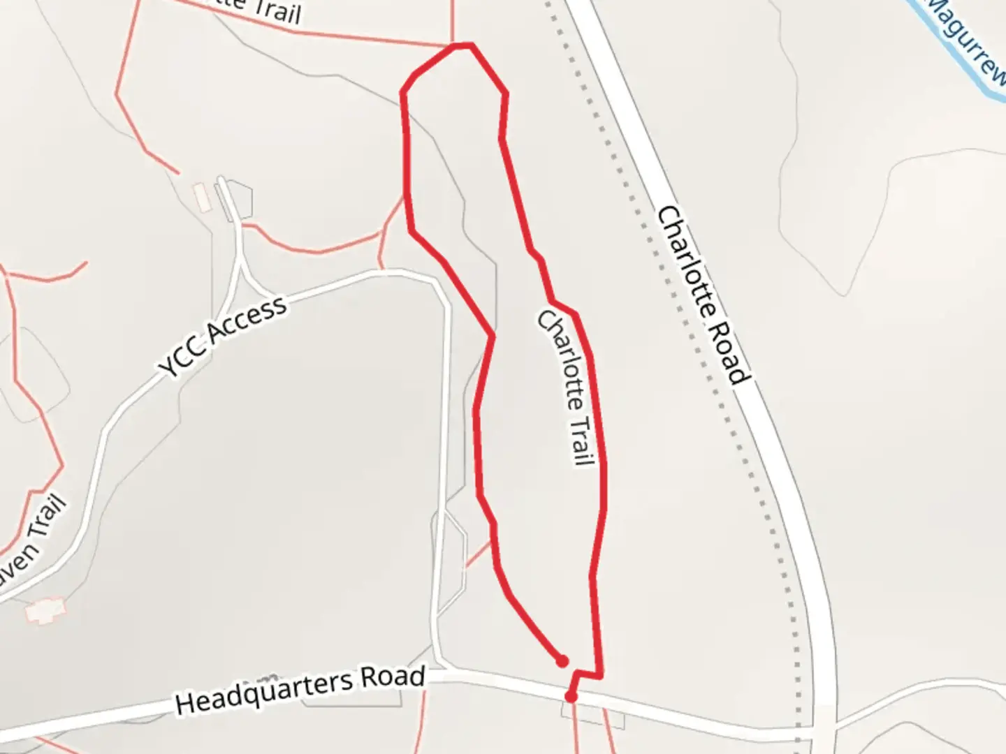 An image depicting the trail Charlotte Loop Headquarters Road and its surrounding area.