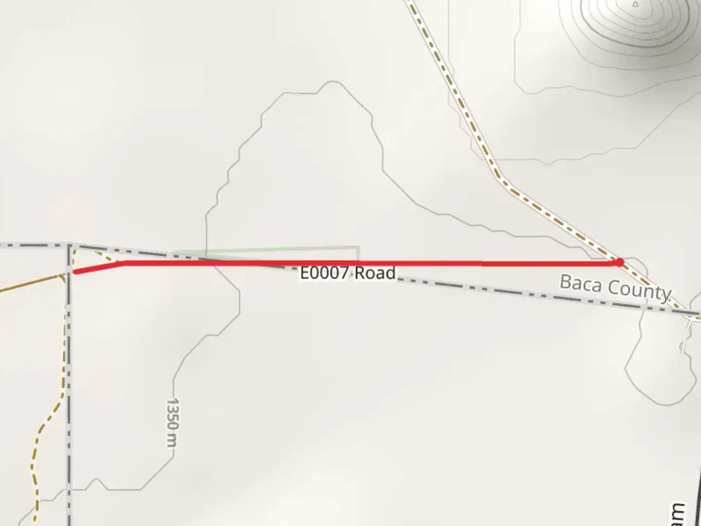 An image depicting the trail Preston Monument at OK-CO-NM Tripoint and its surrounding area.