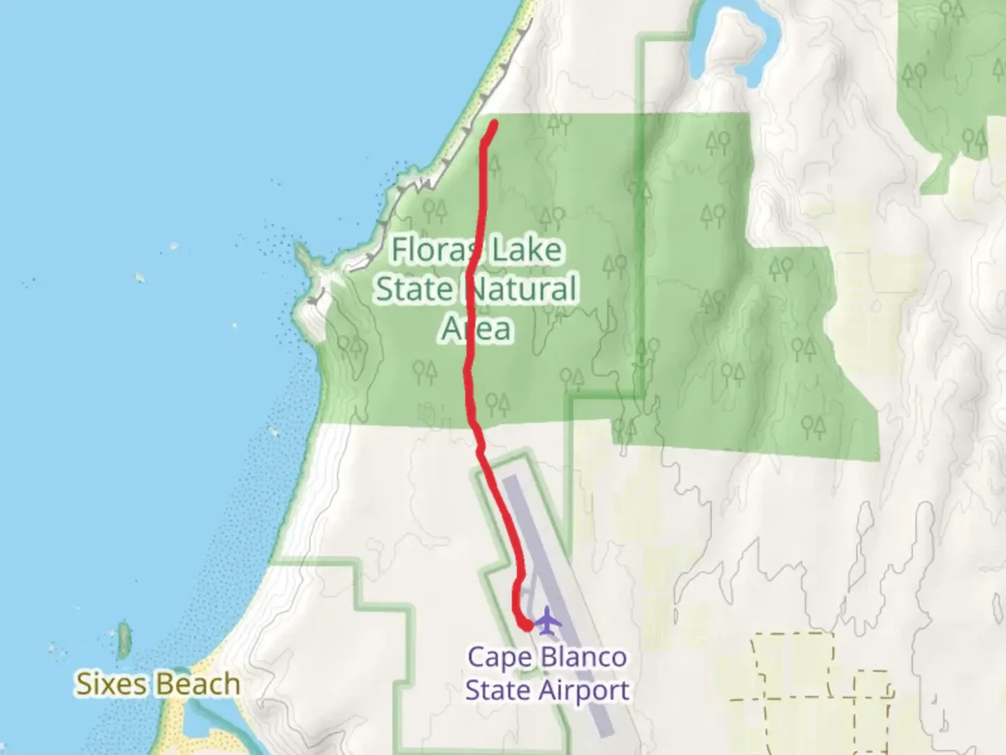 An image depicting the trail Floras Lake State Natural Area and its surrounding area.