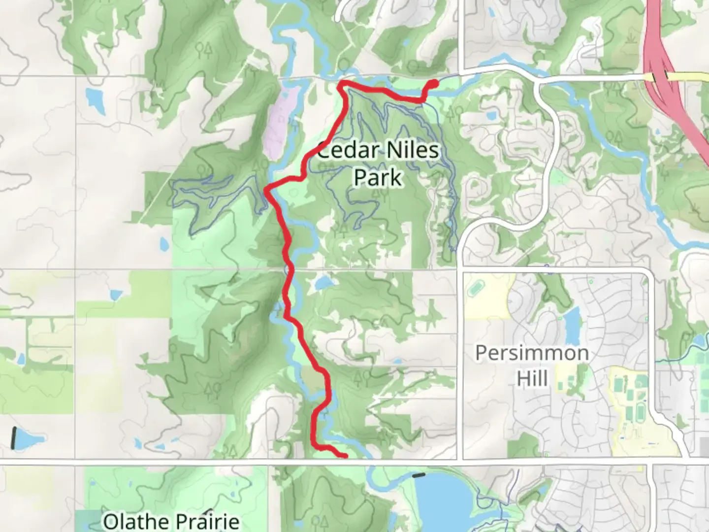 An image depicting the trail Cedar Nile Park Trail and its surrounding area.
