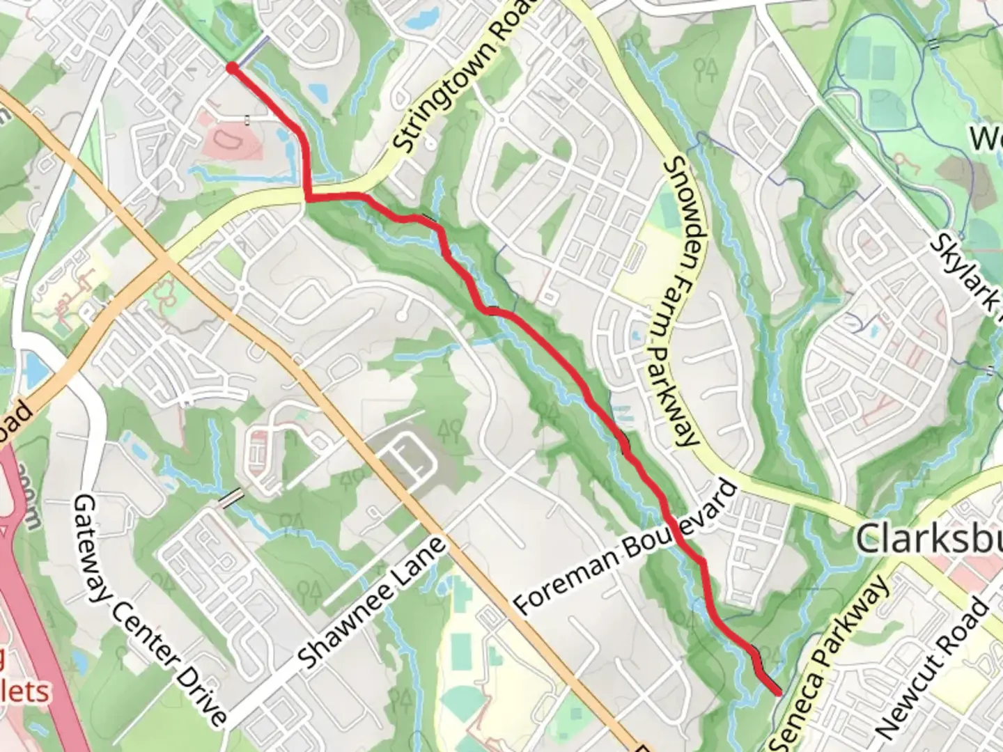 An image depicting the trail Clarksburg Village Walking Trail and its surrounding area.